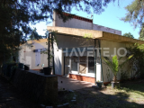 A gated property for sale in Abrantes, Central Portugal, featuring a house, swimming pool, and annex