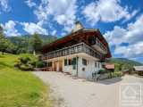 A luxurious traditional farmhouse chalet with 8 bedrooms, 7 bathrooms and a swimming pool.