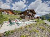 A modern luxury chalet with 3 bedrooms, 2 bathrooms and a double garage, with sunny views.